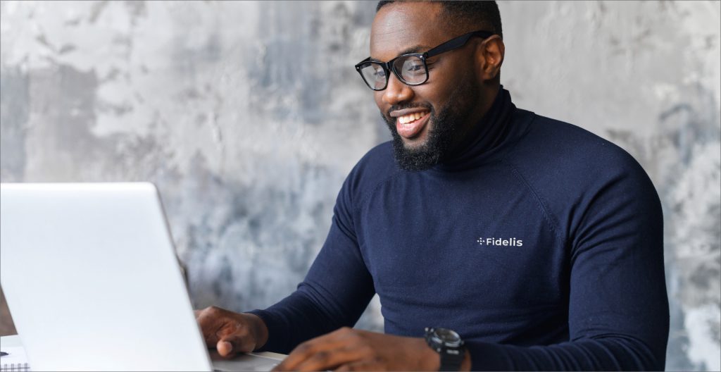 Business man enjoying his work at the computer