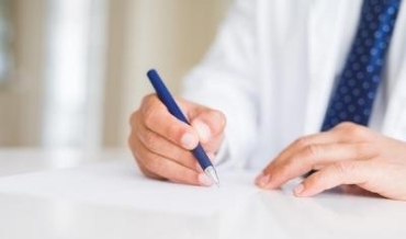 Man writing on a piece of paper