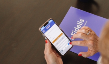 Elderly woman using her phone to access an application